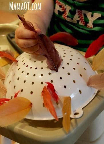 A fine motor skill Thanksgiving activity. Feathers and a colander! More Thanksgiving activities in blog post!
